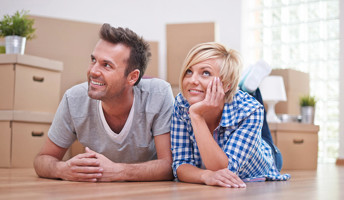 couple enjoying new hardwood flooring from Premier Custom Hardwood Flooring-Services