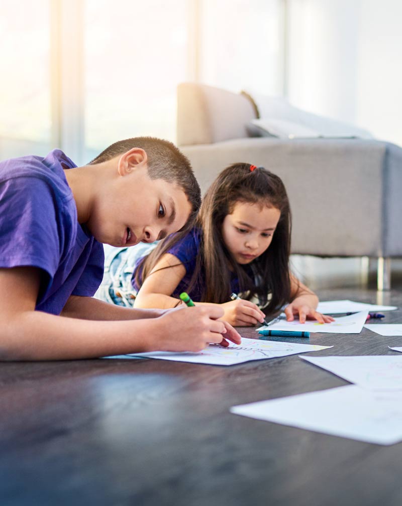 kids-coloring-books-on-wood-floor-800x